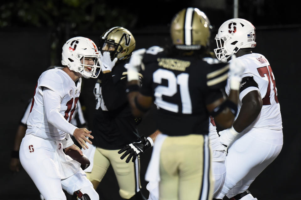 Stanford quarterback Tanner McKee, left, celebrates after running the ball into the end zone for a touchdown against Vanderbilt in the first half of an NCAA college football game Saturday, Sept. 18, 2021, in Nashville, Tenn. (AP Photo/Mark Zaleski)