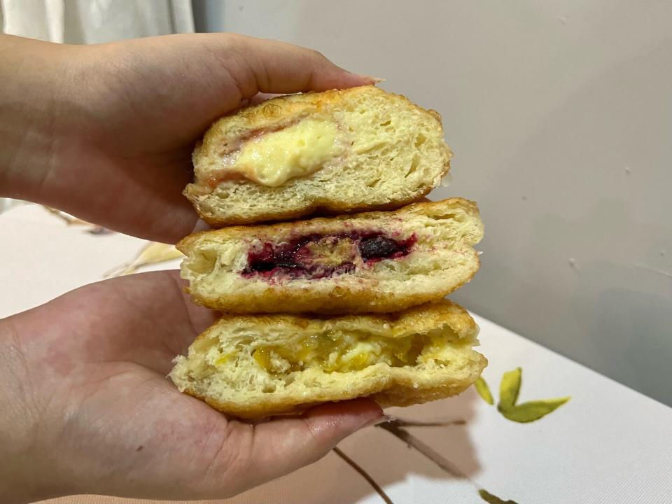 Basket Break Bakehouse - Three doughnuts cut in half,