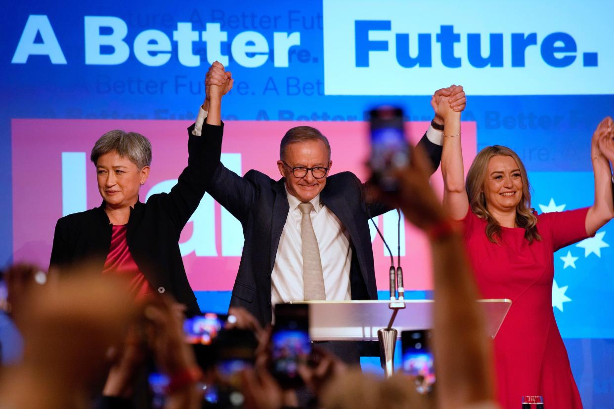 Labor Party leader Anthony Albanese, center back, celebrates with his partner Jodie Haydon (right) and Labor senate leader Penny Wong  in Sydney on Sunday.