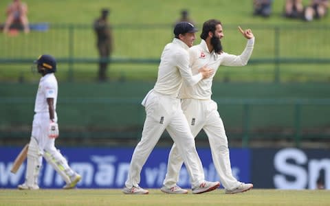 Moeen Ali celebrates with Jos Buttler after dismissing Sri Lanka batsman Dickwella  - Credit: Getty Images