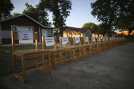 Twenty-one empty chairs are seen outside of a daycare center as a memorial for the victims killed earlier in the week in the elementary school shooting in Uvalde, Texas, Friday, May 27, 2022. (AP Photo/Dario Lopez-Mills)