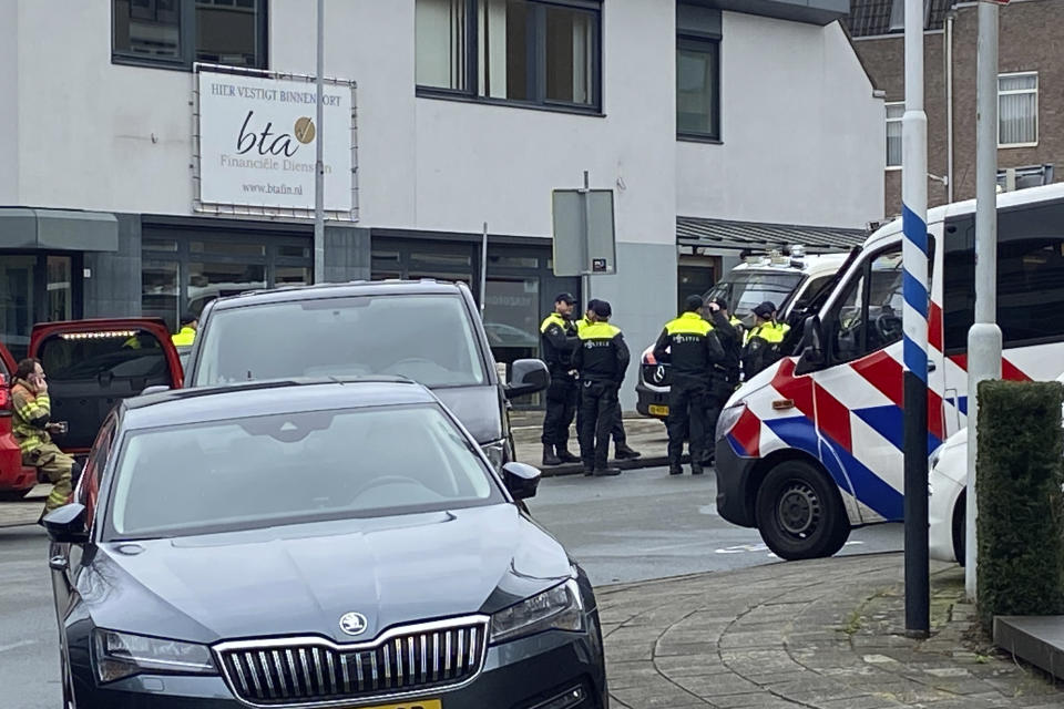 Police gather in Eden, Netherlands, Saturday, March 30, 2024. Heavily armed police have cordoned off part of a Dutch town and say that multiple people are being held hostage in a building there. It is unclear how many people are being held. Police said in a message on X, formerly Twitter, that “at the moment there is no indication of a terrorist motive.” (AP Photo/Aleksandar Furtula)