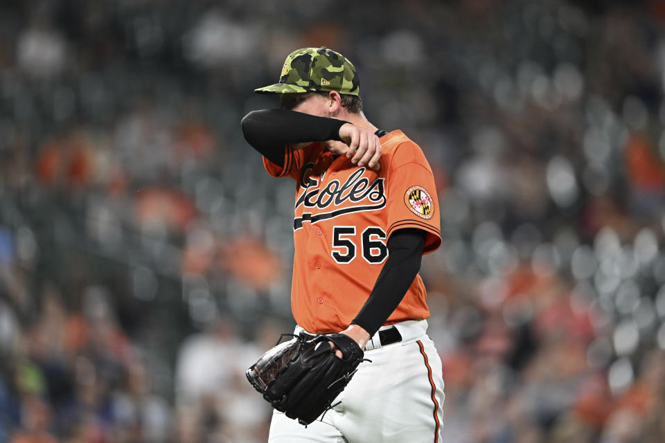 Baltimore Orioles pitcher Kyle Bradish walks to the dugout after leaving the baseball game against the Tampa Bay Rays during the sixth inning Saturday, May 21, 2022, in Baltimore. (AP Photo/Gail Burton)
