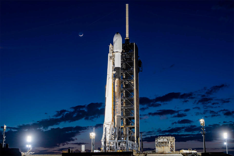 A SpaceX Falcon 9 rocket, with Intuitive Machines' Odysseus lunar lander mounted in a protective nose fairing, readies for launch atop historic Pad 39A at the Kennedy Space Center.  /Credit: SpaceX