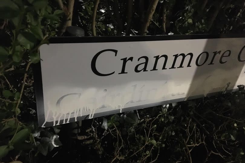 A vandalised sign at Cranmore Gardens -Credit:An Dream Dearg