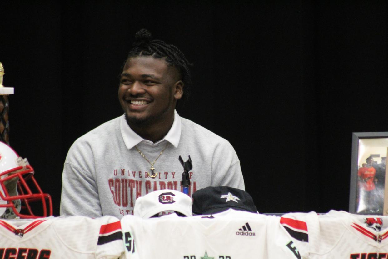 Jackson linebacker Grayson Howard smiles during his pre-signing ceremony to sign a national letter of intent with the University of South Carolina to play college football on December 17, 2022. [Juston Lewis/Florida Times-Union]