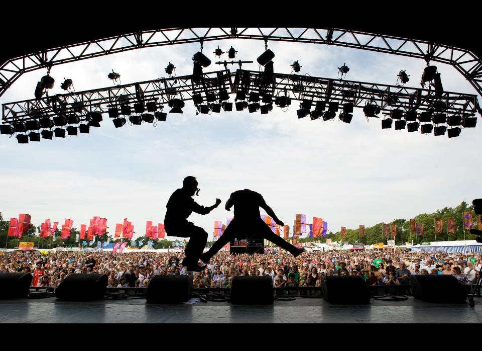 Thom Wylding (R) plays air guitar on the Open Air Stage as 2227 festival-goers attempt to break the Air Guitar World Record in aid of charity Action On Hearing Loss during the Womad Festival 2011 at Charlton Park on July 31, 2011 near Malmesbury in Wiltshire, United Kingdom. (Samir Hussein, Getty Images)