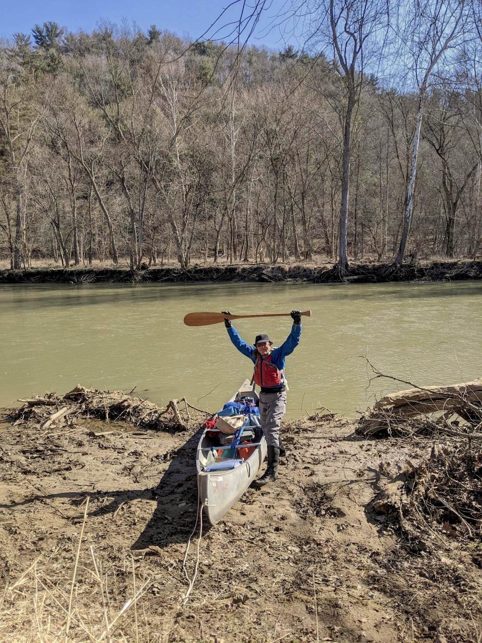 Irv displays his vintage wooden paddle — a gift from the late Bill Conrad — at the start of a day on the Mohican River.