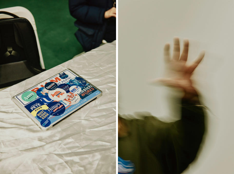 A laptop covered in political stickers; American documentary filmmaker, actor, and author Michael Moore speaking before the debate at the Bernie Sanders 2020 Debate Watch Party in Manchester, N.H. | Tony Luong for TIME