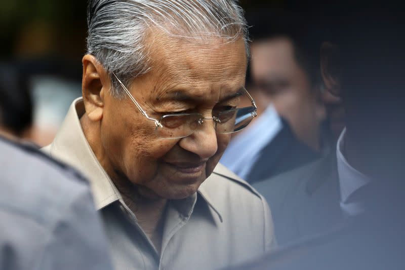 Malaysia's Interim Prime Minister Mahathir Mohamad leaves after an event in Kuala Lumpur