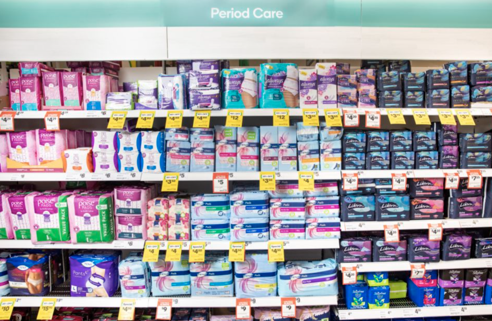 Sanitary products are seen in the Woolworths period care aisle. 