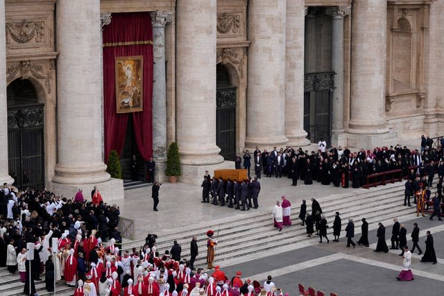 The coffin of late Pope Emeritus Benedict XVI is carried away following his funeral mass at St Peter’s Square, Vatican City 