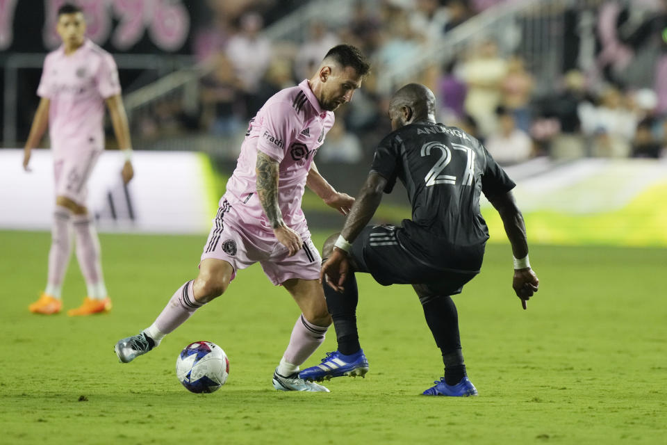 Inter Miami forward Lionel Messi (10) kicks the ball around Nashville SC midfielder Brian Anunga (27) during the first half of an MLS soccer match, Wednesday, Aug. 30, 2023, in Fort Lauderdale, Fla. (AP Photo/Marta Lavandier)