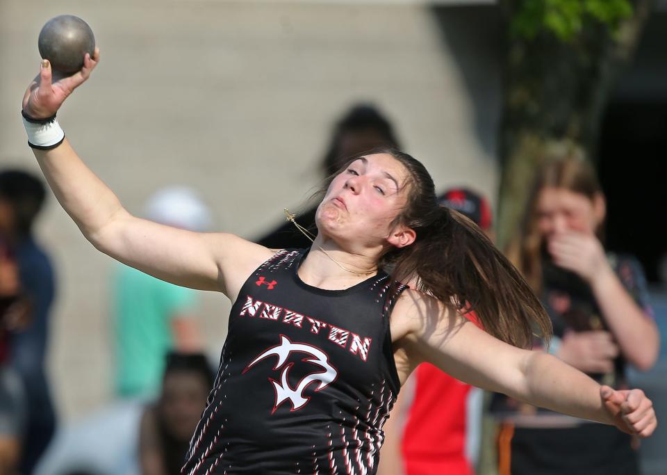 Norton's Morgan Hallett competes in the girls shot put event during the Metro Athletic Conference track and field championship meet in Ravenna on Thursday.