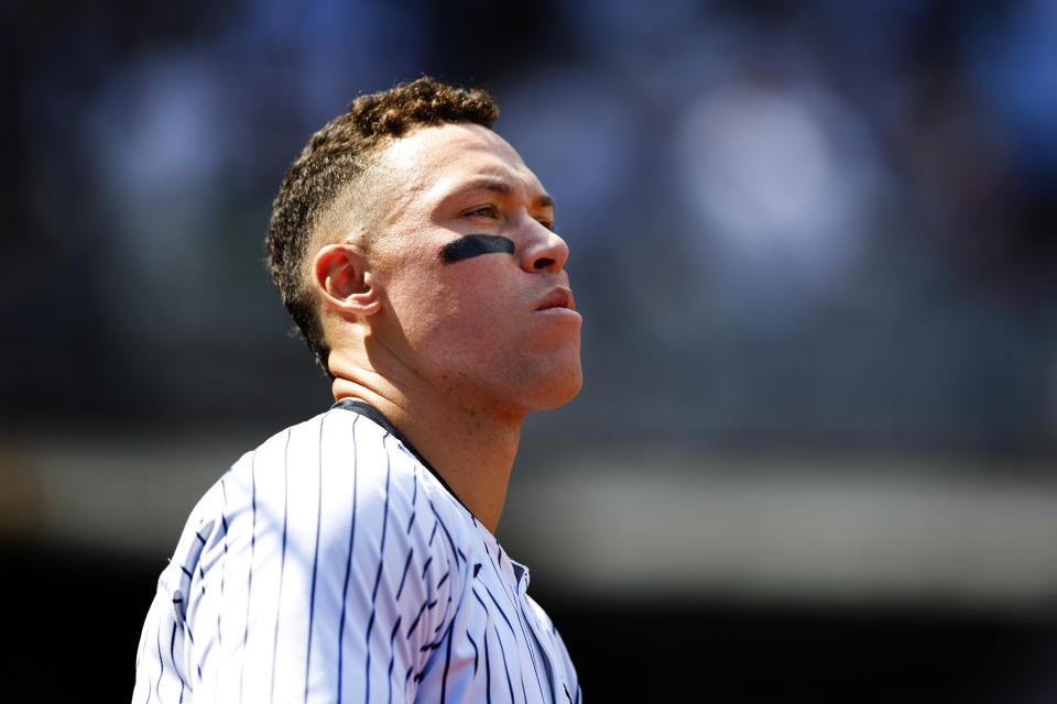 New York Yankees' Aaron Judge (99) looks out from the dugout during the seventh inning inning of a baseball game against the Tampa Bay Rays, Saturday, April 20, 2024 in New York. (AP Photo/Noah K. Murray)