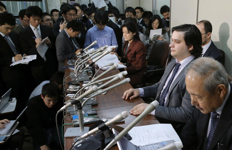 FILE - In this Feb. 28, 2014 file photo, Mt. Gox CEO Mark Karpeles, sitting at second right, attends a press conference at the Justice Ministry in Tokyo. The Mt. Gox bitcoin exchange in Tokyo is headed for liquidation after a court rejected its bankruptcy protection application. Mt. Gox said Wednesday, April 16, 2014, the Tokyo District Court decided the company, which was a trading platform and storehouse for the bitcoin virtual currency, would not be able to resurrect itself under a business rehabilitation process filed for in February. After Mt. Gox went offline in February, its CEO Mark Karpeles said that 850,000 bitcoins worth several hundred millions dollars were unaccounted for, blaming a weakness in the exchange’s systems. (AP Photo/Kyodo News, File) JAPAN OUT, MANDATORY CREDIT