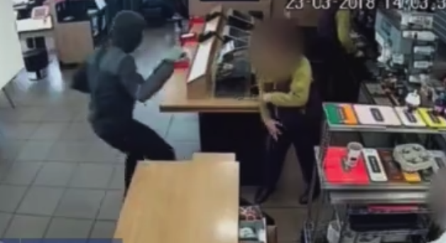 The man is then seen threatening staff before making his escape (SWNS)