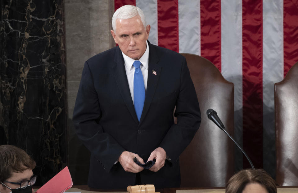 FILE - Vice President Mike Pence presides over a joint session of Congress as it convenes to count the Electoral College votes cast in November's election, at the Capitol in Washington, Jan. 6, 2021. The House committee investigating the Jan. 6 insurrection has interviewed nearly 1,000 people. But the nine-member panel has yet to talk to the two most prominent players in that day’s events – former President Donald Trump and former Vice President Mike Pence. (Saul Loeb/Pool via AP, File)