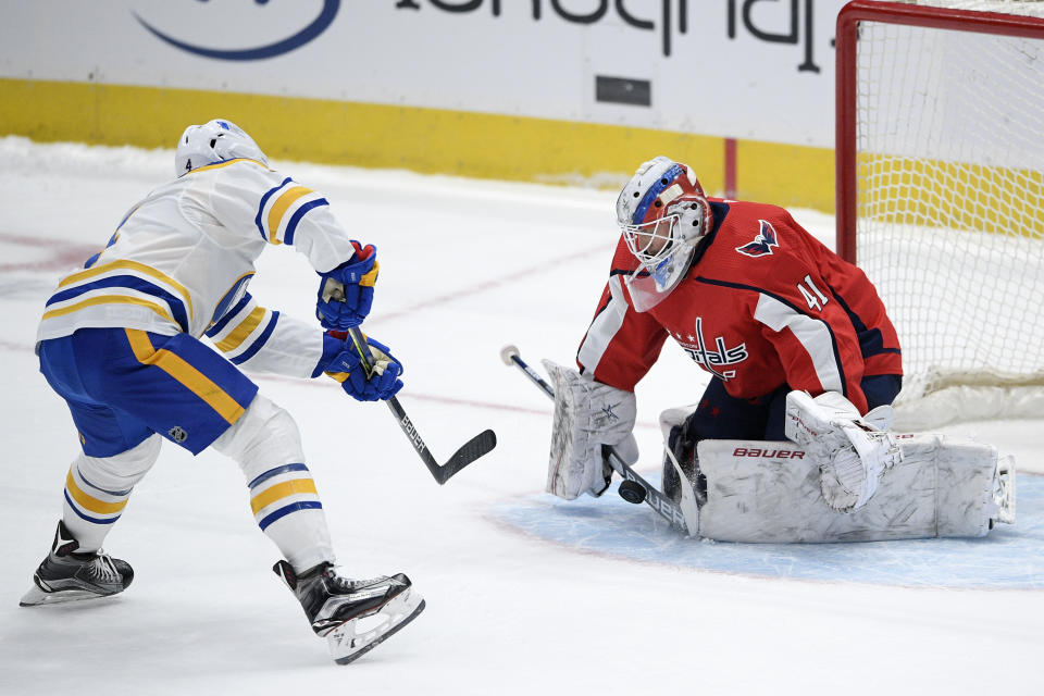 Washington Capitals goaltender Vitek Vanecek (41) stops a shot by Buffalo Sabres left wing Taylor Hall (4) during the shootout of an NHL hockey game, Friday, Jan. 22, 2021, in Washington. (AP Photo/Nick Wass)