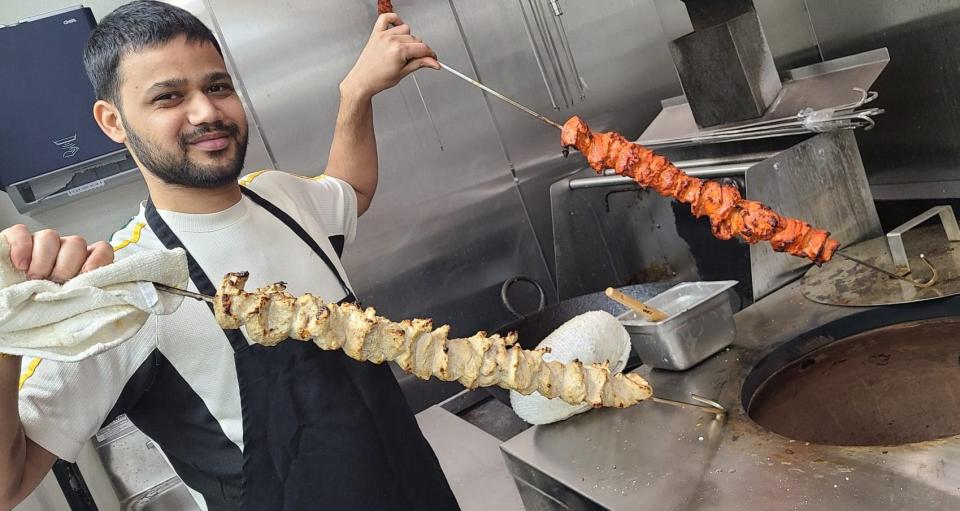 Chef Ankith at the tandoor oven at Aha Indian Grill in Spring Hill.