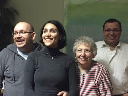 Jason Rezaian (L) is pictured with his wife Yeganeh Salehi (2nd R), mother Mary Rezaian and brother Ali Rezaian (R) in this January 18, 2016 handout photo taken in Landstuhl, Germany. REUTERS/Martin Baron/The Washington Post/Handout via Reuters