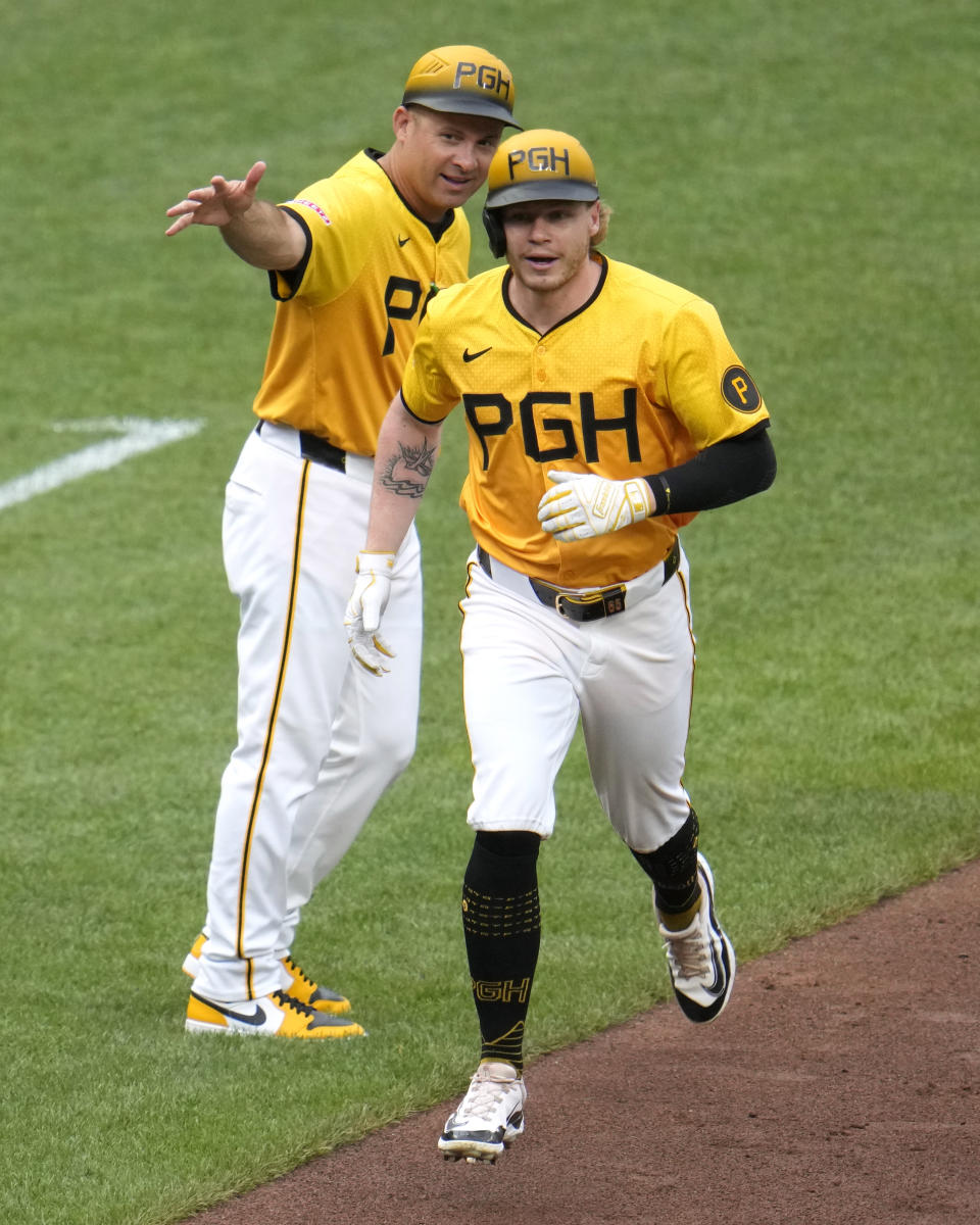 Pittsburgh Pirates' Jack Suwinski, right, rounds third after hitting a solo home run off New York Mets starting pitcher Luis Severino during the fourth inning of a baseball game in Pittsburgh, Friday, July 5, 2024. (AP Photo/Gene J. Puskar)
