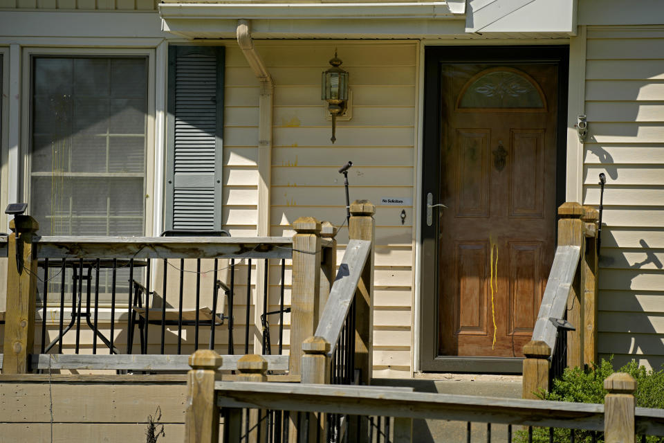 Dried egg is seen on the front of a house, Monday, April 17, 2023, where 16-year-old Ralph Yarl was shot Thursday after he went to the wrong address to pick up his younger brothers in Kansas City, Mo. (AP Photo/Charlie Riedel)