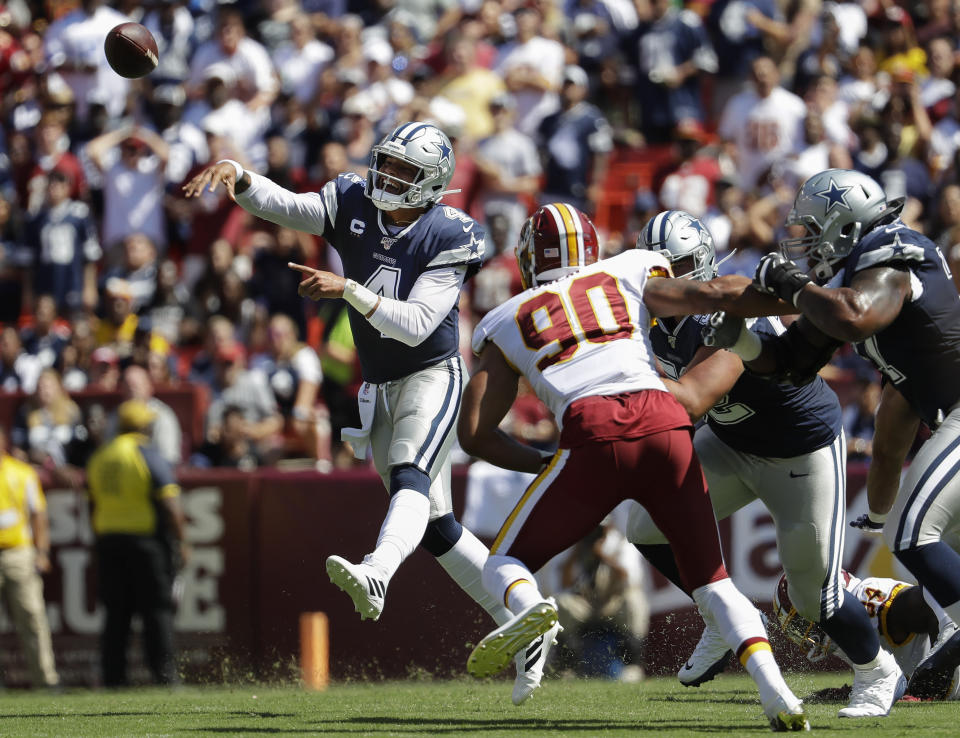 Dallas Cowboys quarterback Dak Prescott (4) throws a pass in the first half of an NFL football game against the Washington Redskins, Sunday, Sept. 15, 2019, in Landover, Md. (AP Photo/Evan Vucci)