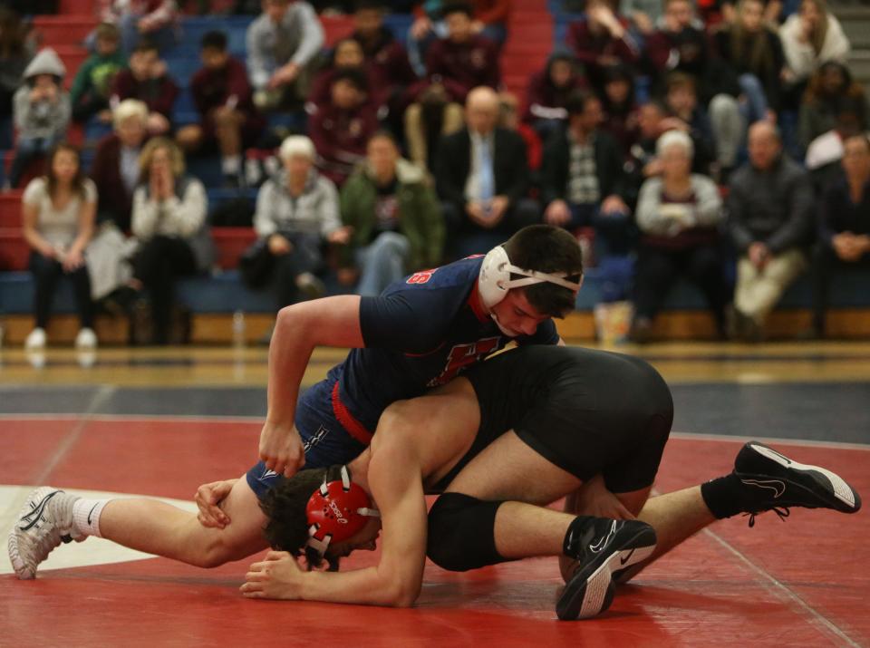 Ketcham's Gavin McLaughlin vs. Arlington's Joseph Peretta during Wednesday's match on January 8, 2020.  