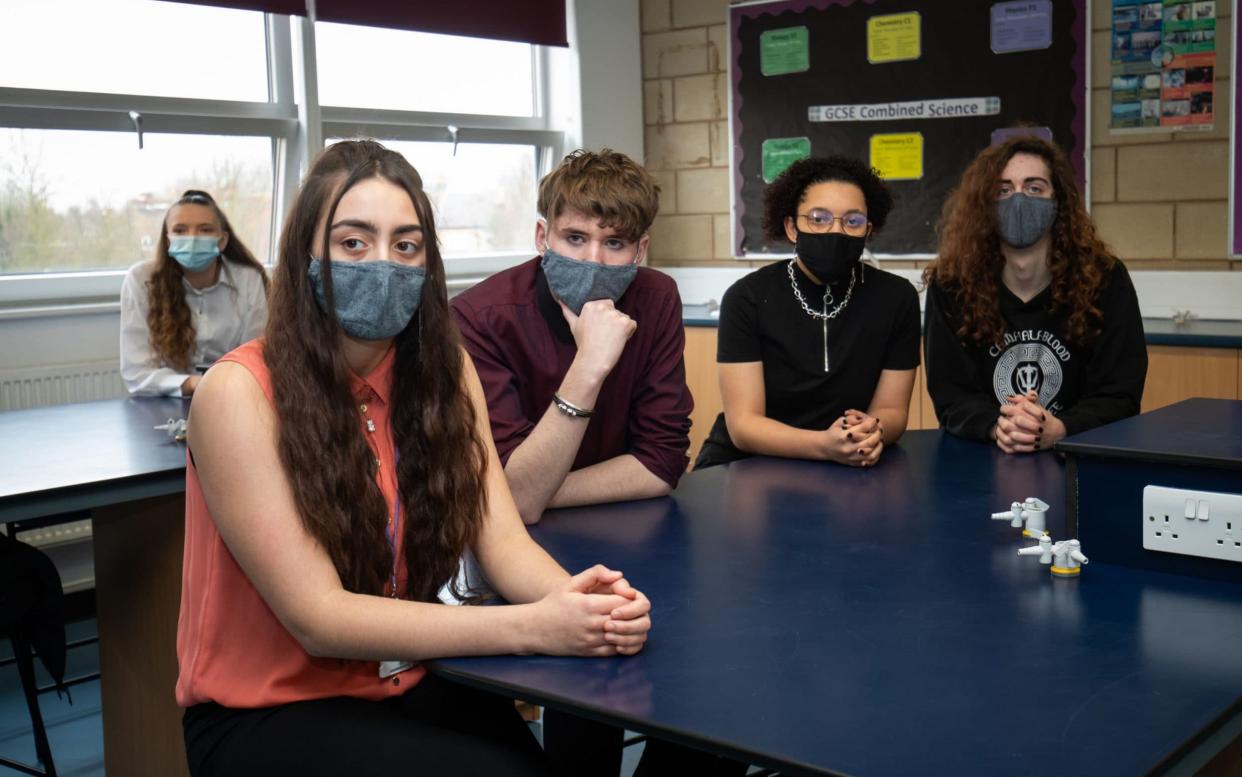 Pupils at a school in Coydon wear face masks in the classroom – a requirement that is set to end on May 17 - Aaron Chown/PA