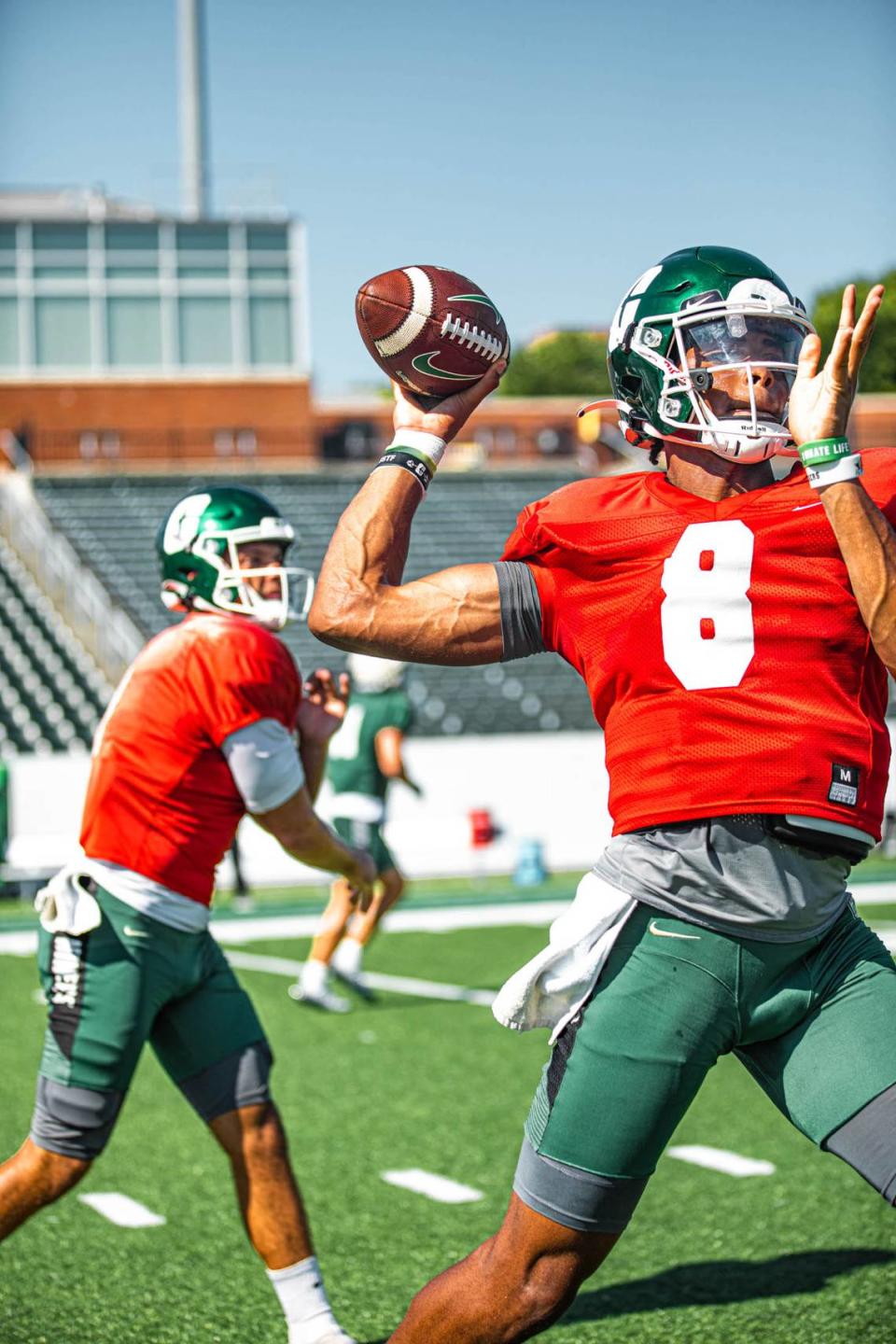 Charlotte 49ers quarterbacks Xavier Williams (8) and Chris Reynolds throw during a recent practice. Charlotte 49ers Athletics/Charlotte 49ers Athletics