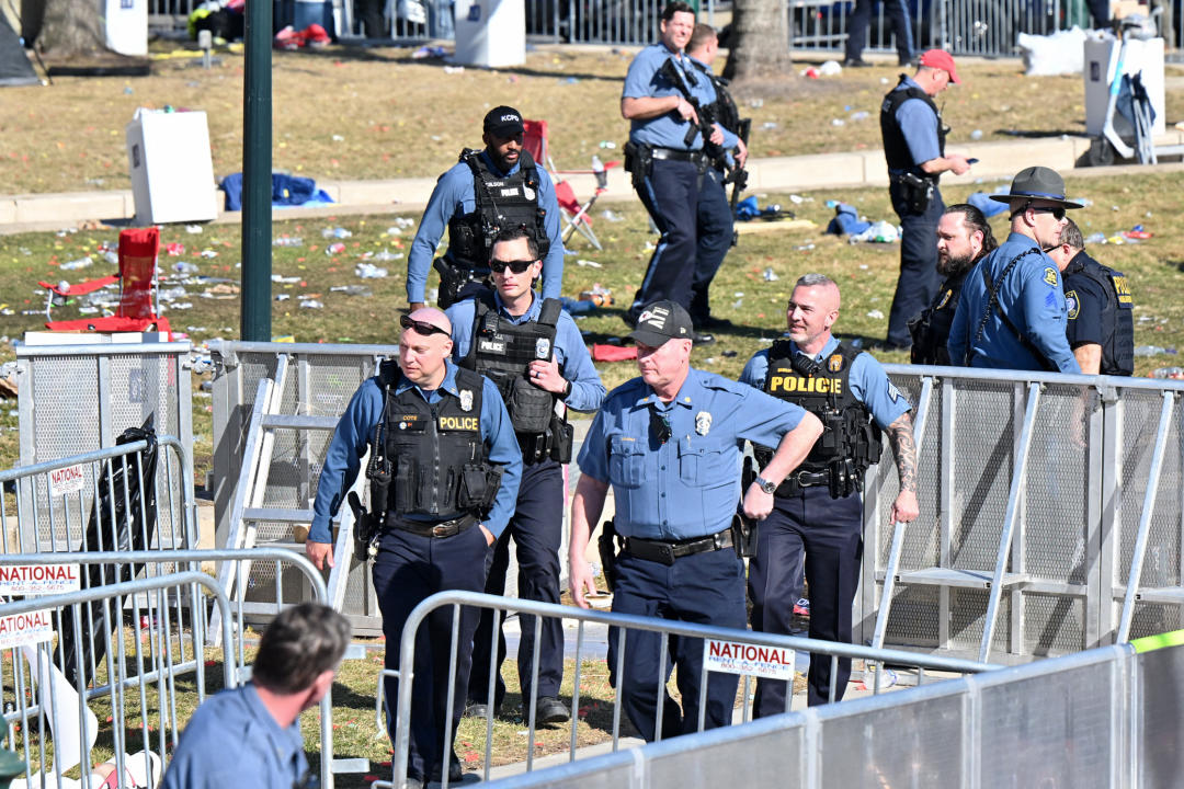 Police help clear the scene of the shooting.