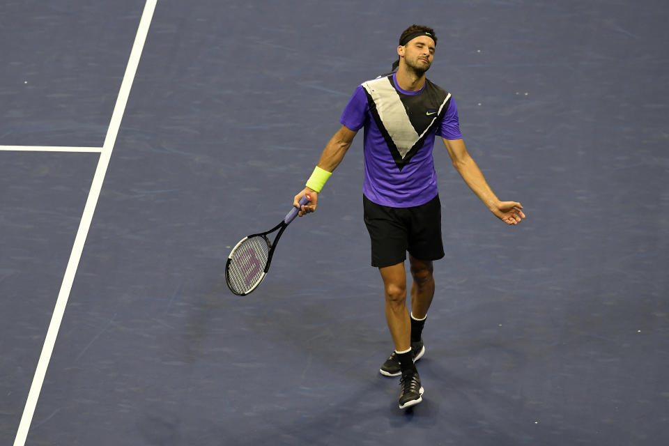 Grigor Dimitrov, of Bulgaria, reacts after losing a point to Daniil Medvedev, of Russia, during the men's singles semifinals of the U.S. Open tennis championships Friday, Sept. 6, 2019, in New York. (AP Photo/Sarah Stier)