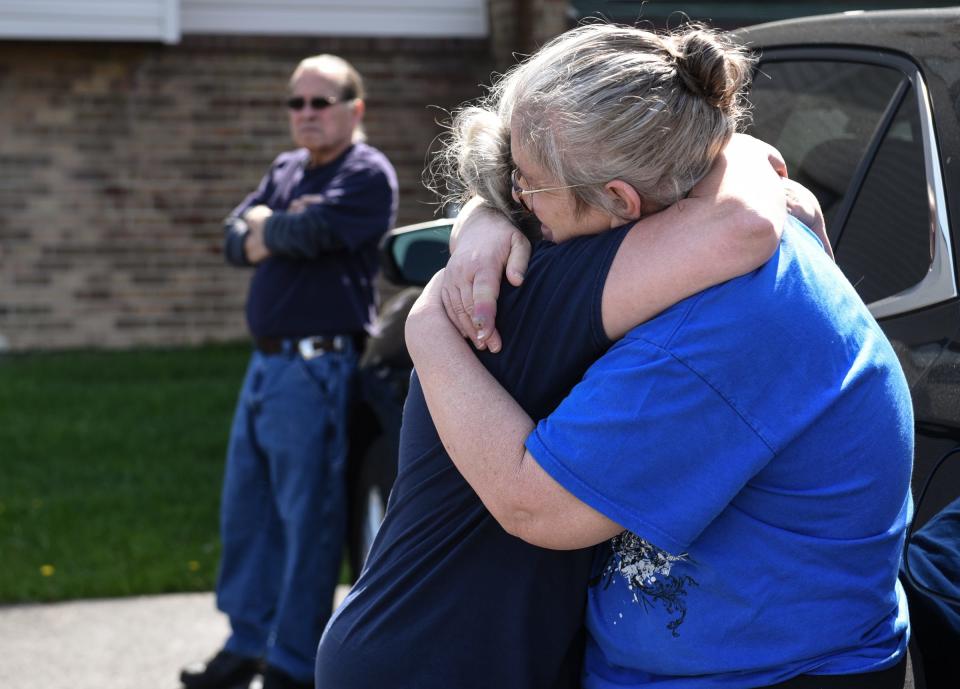 Kim Johnson, right, of Lansing, hugs a friend Thursday, May 11, 2023, before a search party heads out from the Johnsons' residence at Delta Square Apartments looking for her husband Richard Johnson, who was last seen May 7 at the neighboring Plumtree Apartments.