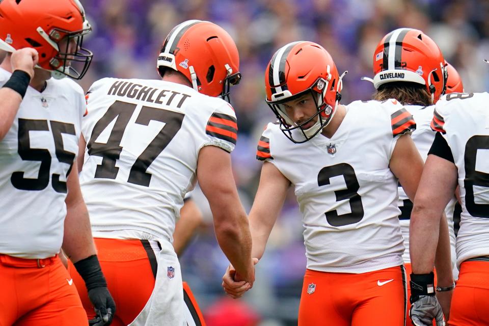 Cleveland Browns place kicker Cade York (3) celebrates with Cleveland Browns long snapper Charley Hughlett (47) after kicking a field goal against the Baltimore Ravens in the first half of an NFL football game, Sunday, Oct. 23, 2022, in Baltimore. (AP Photo/Julio Cortez)