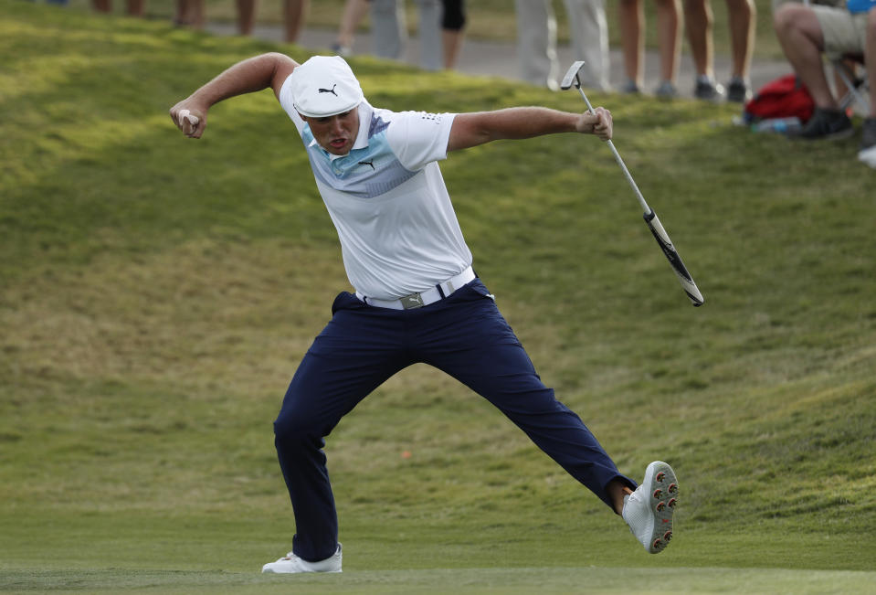 Bryson DeChambeau celebrates after sinking a putt for an eagle on the 16th green during the final round of the Shriners Hospitals for Children Open golf tournament Sunday, Nov. 4, 2018, in Las Vegas. (AP Photo/John Locher)