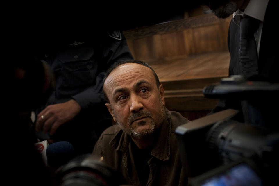 FILE - In this file photo taken Wednesday, Jan. 25, 2012, senior Fatah leader Marwan Barghouti appears at Jerusalem's court. According to several top officials, the Palestinians are seeking the freedom of Barghouti, who is serving multiple life sentences for his alleged role in killings of Israelis, as part of any plan to extend negotiations with Israel beyond a deadline in April, 2014. (AP Photo/Bernat Armangue, File)