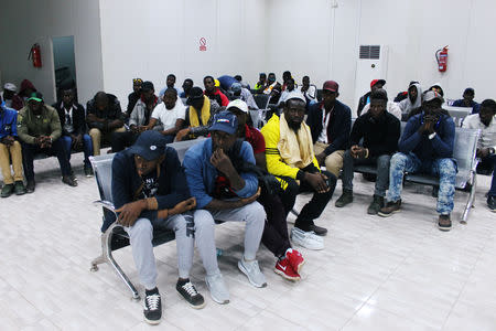 Migrants from Mali wait at Misrata airport before their return to their countries, in Misrata, Libya September 20, 2018. REUTERS/Ayman al-Sahili