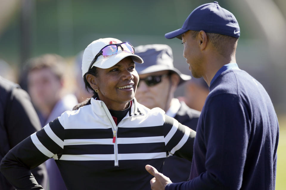 Former Secretary of State Condoleezza Rice, left, talks to Tiger Woods on the 17th hole during the Genesis Invitational pro-am golf event at Riviera Country Club, Wednesday, Feb. 12, 2020, in the Pacific Palisades area of Los Angeles. (AP Photo/Ryan Kang)