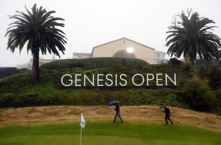 February 14, 2019; Pacific Palisades, CA, USA; General view of signage as spectators walk by during a stoppage in play in the first round of the Genesis Open golf tournament at Riviera Country Club. Mandatory Credit: Gary A. Vasquez-USA TODAY Sports