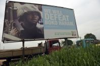Picture shows a campaign signboad displayed by the ruling All Progressives Congress (APC)in Ogijo, Ogun State in southwest Nigeria, on July 3, 2015
