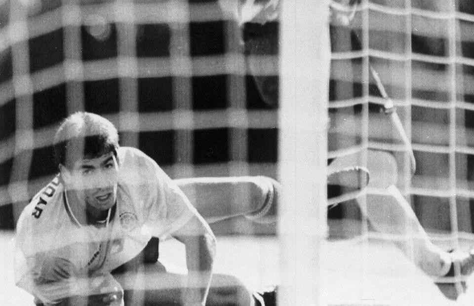 FILE - Colombia's Andres Escobar, lies on the ground during a World Cup soccer match against the United States in the Rose Bowl, Pasadena on June 22, 1994. The US defeated Colombia by 2-1, with Escobar scoring an own-goal. Just a few days later, Escobar was shot dead in his home town of Medellin. (AP Photo/Eric Draper, File)