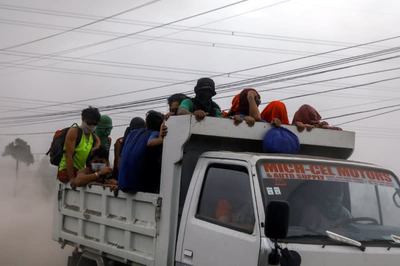 Residents living near the erupting Taal Volcano are evacuated in Agoncillo, Batangas City