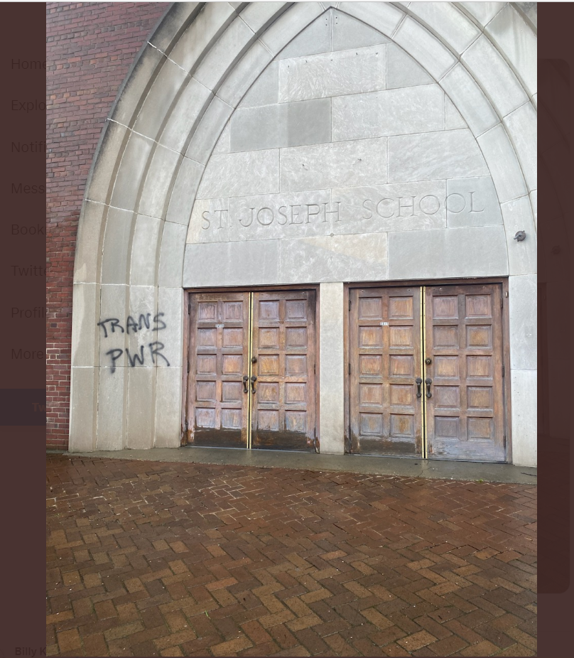 Graffiti with a "TRANS PWR" message was found outside St. Joseph Catholic in Louisville's Butchertown neighborhood, Friday, March 3, 2022. A day earlier, the Kentucky House passed a bill limiting gender-affirming treatment for children.