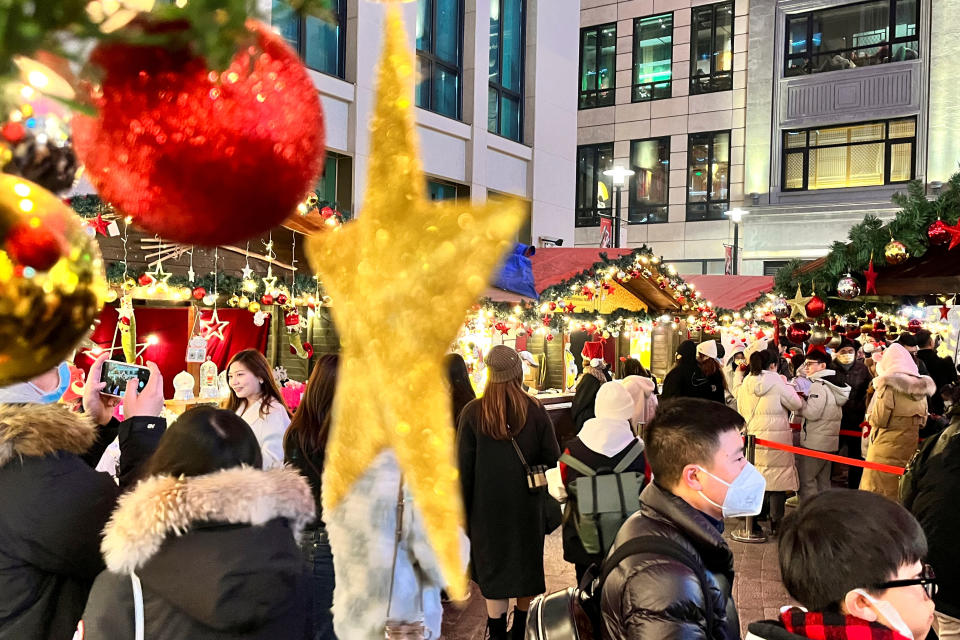 People visit a Christmas market, as coronavirus disease (COVID-19) outbreaks continue, in Shanghai, China December 24, 2022. REUTERS/Staff