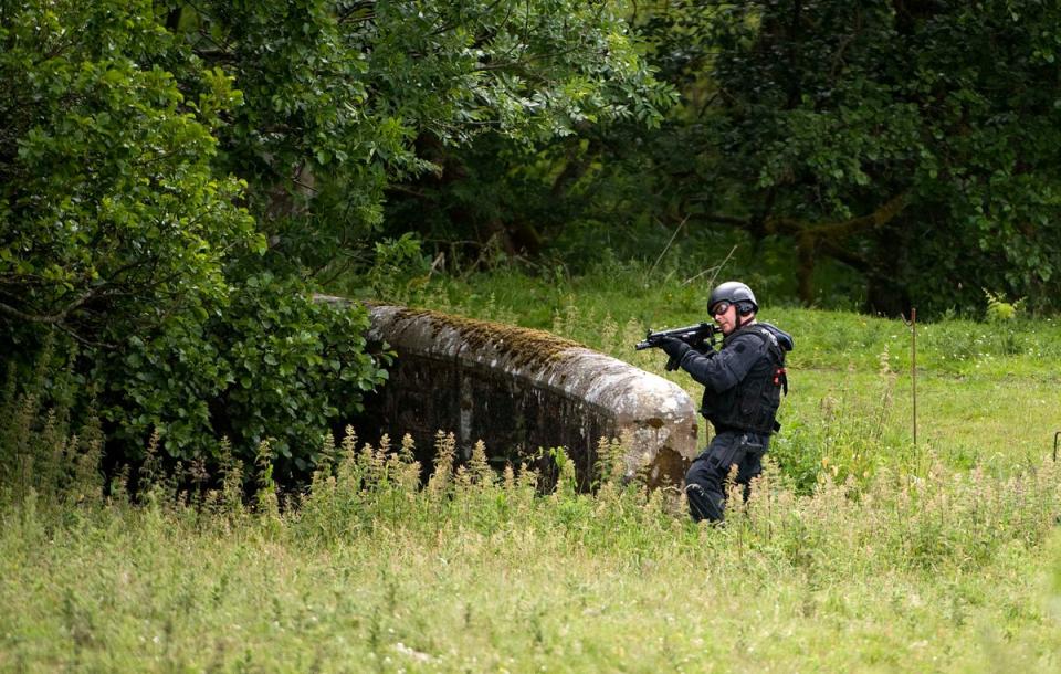 Police on the hunt for Moat in 2010 (AFP via Getty Images)