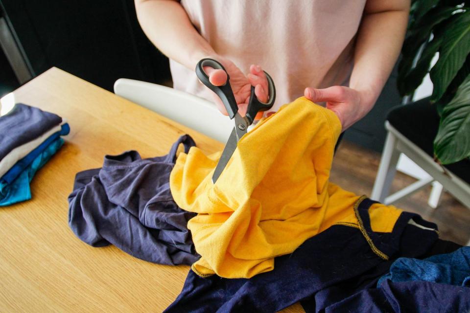 cutting old clothes