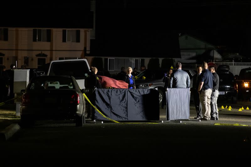 Investigators examine the scene in Lacey, Washington where law enforcement officers reportedly shot and killed Michael Forest Reinoehl