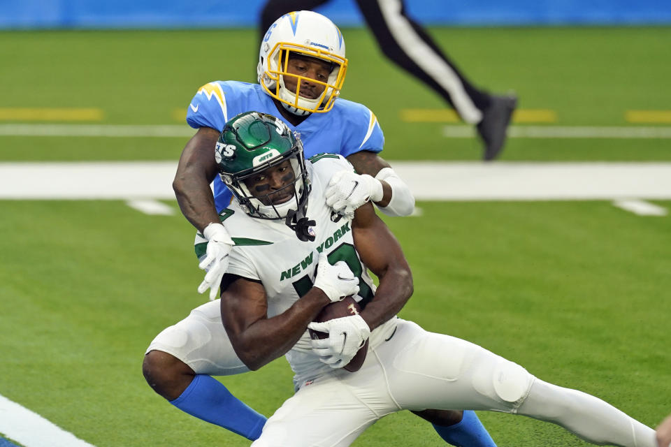 New York Jets wide receiver Breshad Perriman, bottom, catches a touchdown pass under Los Angeles Chargers cornerback Casey Hayward during the second half of an NFL football game Sunday, Nov. 22, 2020, in Inglewood, Calif. (AP Photo/Jae C. Hong)