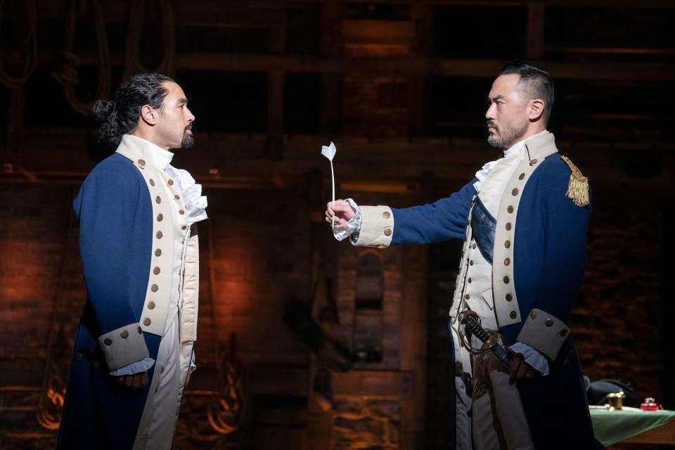 Pierre Jean Gonzalez, left, and Marcus Choi perform with the North American touring company of "Hamilton" in 2021.